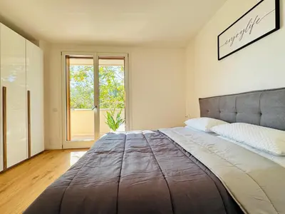 Letto o letti in una camera di Modern penthouse in Treviso with terrace and garage