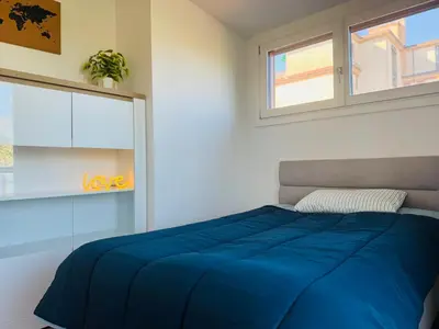 Letto o letti in una camera di Modern penthouse in Treviso with terrace and garage