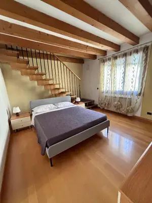 Letto o letti in una camera di Ca' Elisa