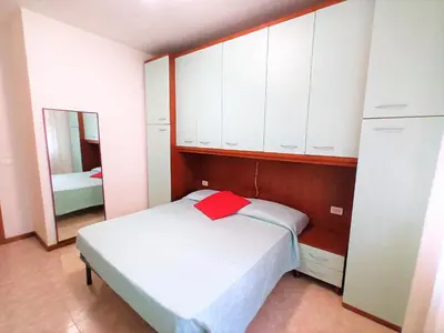 Letto o letti in una camera di Trilocale piano terra con doppi servizi Piazza Aurora