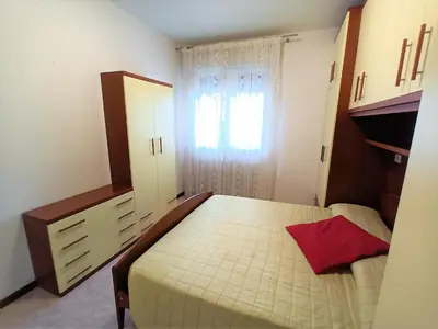 Letto o letti in una camera di Trilocale piano terra con doppi servizi Piazza Aurora