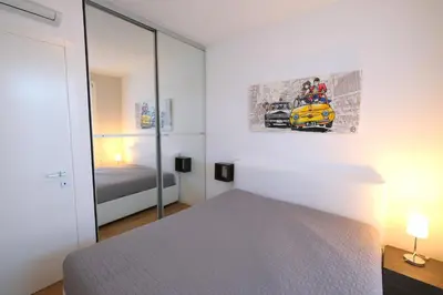 Letto o letti in una camera di Wave Village piano terra Piazza Trieste