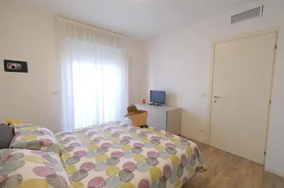 Letto o letti in una camera di Moderno trilocale con doppi servizi Piazza Marconi