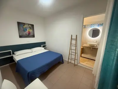 Letto o letti in una camera di Spacious apartment near the beach