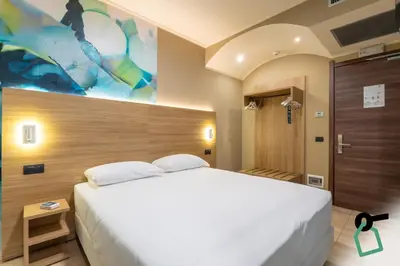 Letto o letti in una camera di Hotiday Conegliano