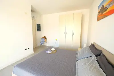 Letto o letti in una camera di Bilocale in Residence Piazza Brescia