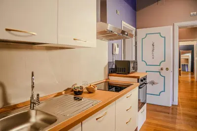 Cucina o angolo cottura di Palazzo delle Tre Lune Apartments