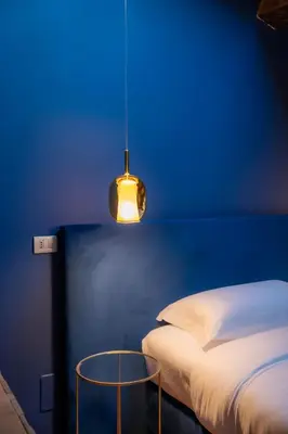 Letto o letti in una camera di Palazzo delle Tre Lune Apartments