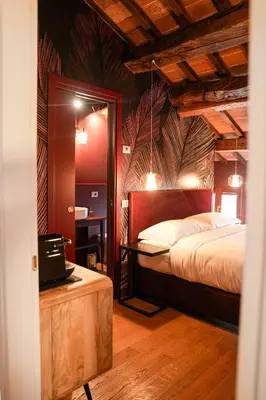 Letto o letti in una camera di Palazzo delle Tre Lune Apartments