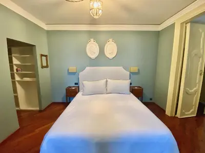 Letto o letti in una camera di Palazzo Mantua Benavides Suites & Apartments