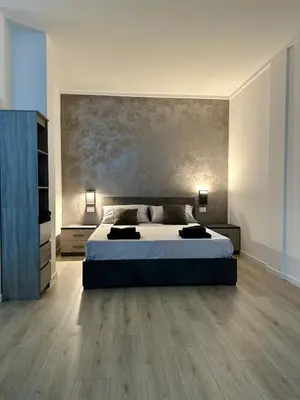 Letto o letti in una camera di Hidden Style Urban Loft Near Venice