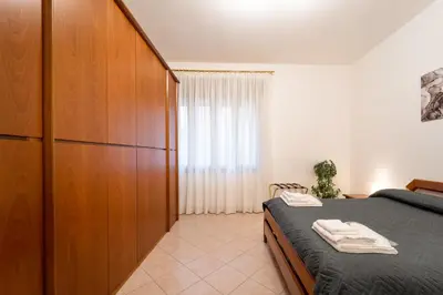 Letto o letti in una camera di Al Pettirosso family apartment