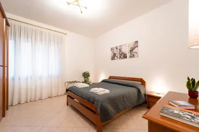 Letto o letti in una camera di Al Pettirosso family apartment
