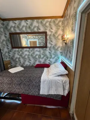 Letto o letti in una camera di Just for Single Exclusive Lionsclass