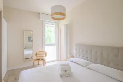 Letto o letti in una camera di GuestHost - Cozy Apt near Basilica Sant'Antonio