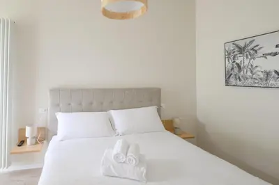 Letto o letti in una camera di GuestHost - Cozy Apt near Basilica Sant'Antonio