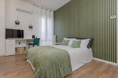 Letto o letti in una camera di 'Suite Bailo' - Treviso center - Near VENICE - wi-fi e AC free - Smart working