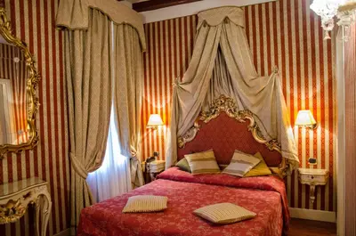 Letto o letti in una camera di Dimora Dogale