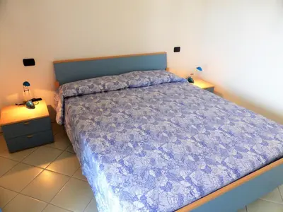 Letto o letti in una camera di Residence Aurora Park zona Piazza Aurora