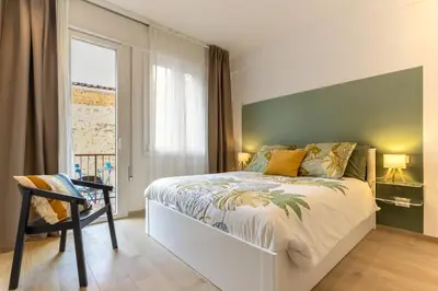 Letto o letti in una camera di Estense Home - near Duomo