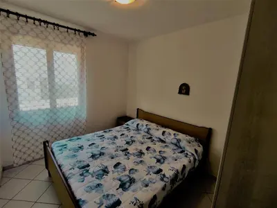 Letto o letti in una camera di RESIDENCE ISOLA Valencia 3