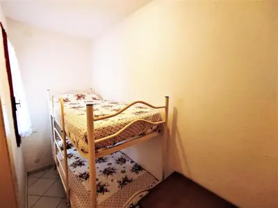 Letto o letti in una camera di RESIDENCE ISOLA Valencia 3
