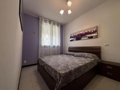 Letto o letti in una camera di Bright apartment with pool near the sea