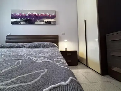 Letto o letti in una camera di Bright apartment with pool near the sea