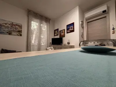 TV o dispositivi per l'intrattenimento presso Accommodation in the vibrant heart of Rosolina