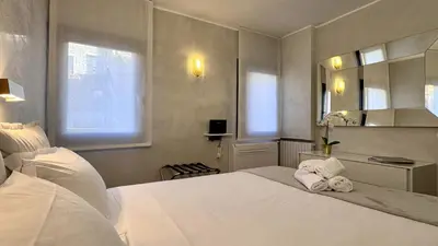 Letto o letti in una camera di Le Masque Terrace Prestige