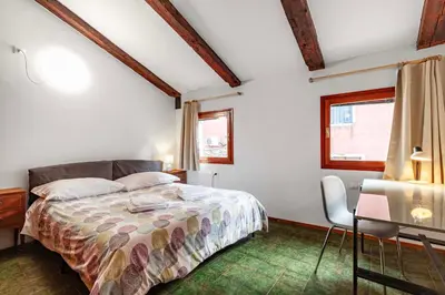 Letto o letti in una camera di Attico Blenner