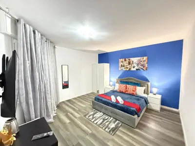 Letto o letti in una camera di Casa Raffinata