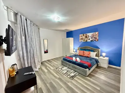 Letto o letti in una camera di Casa Raffinata