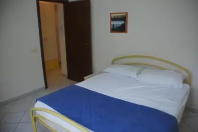 Letto o letti in una camera di Bright flat in Rosolina with shared pool