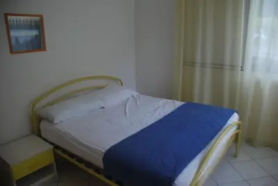 Letto o letti in una camera di Bright flat in Rosolina with shared pool