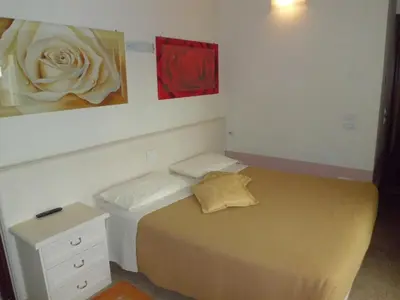 Letto o letti in una camera di Sweet Home