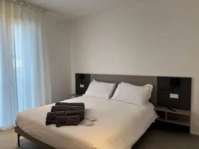 Letto o letti in una camera di A&G Elettra flat a pochi passi dal mare e Venezia