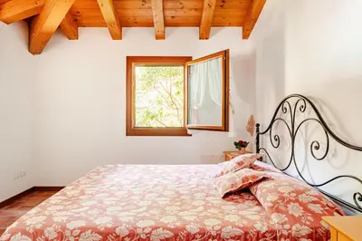 Letto o letti in una camera di Alloggio immerso nella Laguna