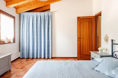 Letto o letti in una camera di Alloggio immerso nella Laguna