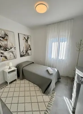 Letto o letti in una camera di Ai Portici Guest House