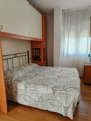 Letto o letti in una camera di Attico Alghe Rosse Jesolo lido