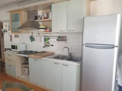 Cucina o angolo cottura di Attico Alghe Rosse Jesolo lido