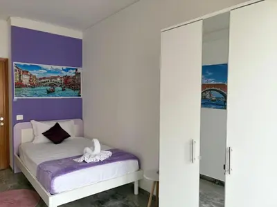 Letto o letti in una camera di Leone Di Venezia