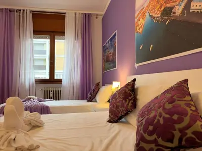 Letto o letti in una camera di Leone Di Venezia