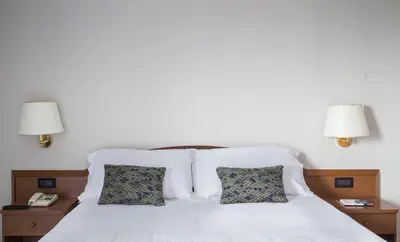 Letto o letti in una camera di Hotel Beatrice