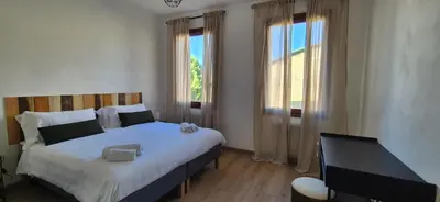 Letto o letti in una camera di Dimora Astolfo 1-2-3