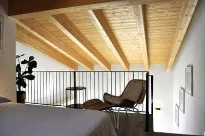 Letto o letti in una camera di Giardino di Lei