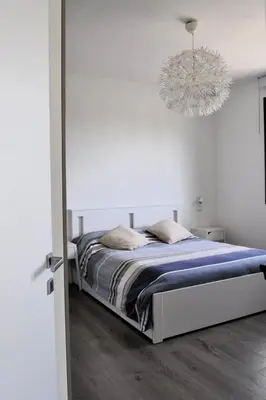 Letto o letti in una camera di Giardino di Lei