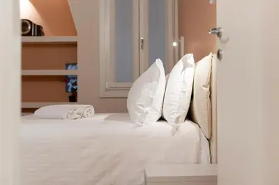Letto o letti in una camera di VeNICe Cera Atelier San Trovaso
