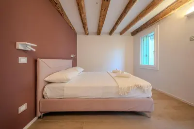Letto o letti in una camera di La Cereria Design Flats - Il Ceramista